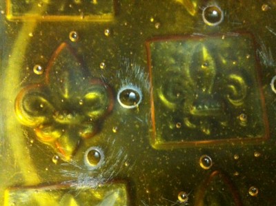 Photo of slumped tray with bubbles that burst when slumping.  I think it also devitrified, whatever that means